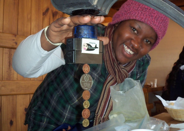 Nelson Mandela University Student levitating Argentine and  British coins